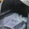 4-14-dbfab96feef7.webp Louis Vuitton Keepall 50 Blue Graphite