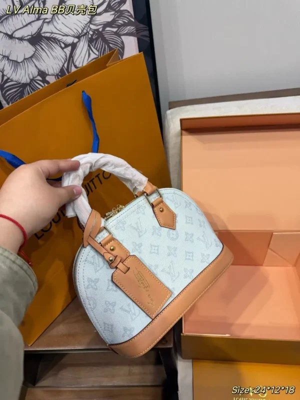 WhatsApp-Image-2026-07-02-at-14.33.09-1.webp Louis Vuitton Alma BB Bag Monogram Origine Bleu Courrier 23.5cm M27526