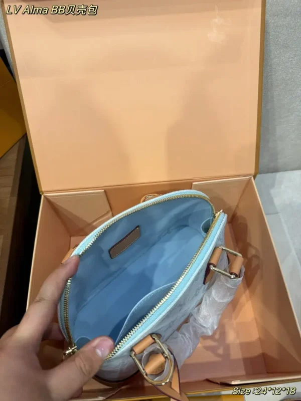 WhatsApp-Image-2026-07-02-at-14.33.13-1.webp Louis Vuitton Alma BB Bag Monogram Origine Bleu Courrier 23.5cm M27526