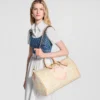 louis-vuitton-keepall-bandouliere-45-M28678_PM1_Cropped-worn-view-1.webp Louis Vuitton Keepall Bandoulière Bag 50cm/19.7in Banana Yellow M28678